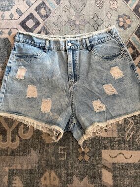 High-Rise Light Blue Distressed Denim Shorts with Frayed Hem